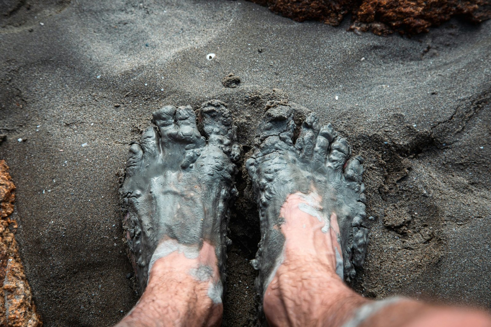 a pair of feet in the sand