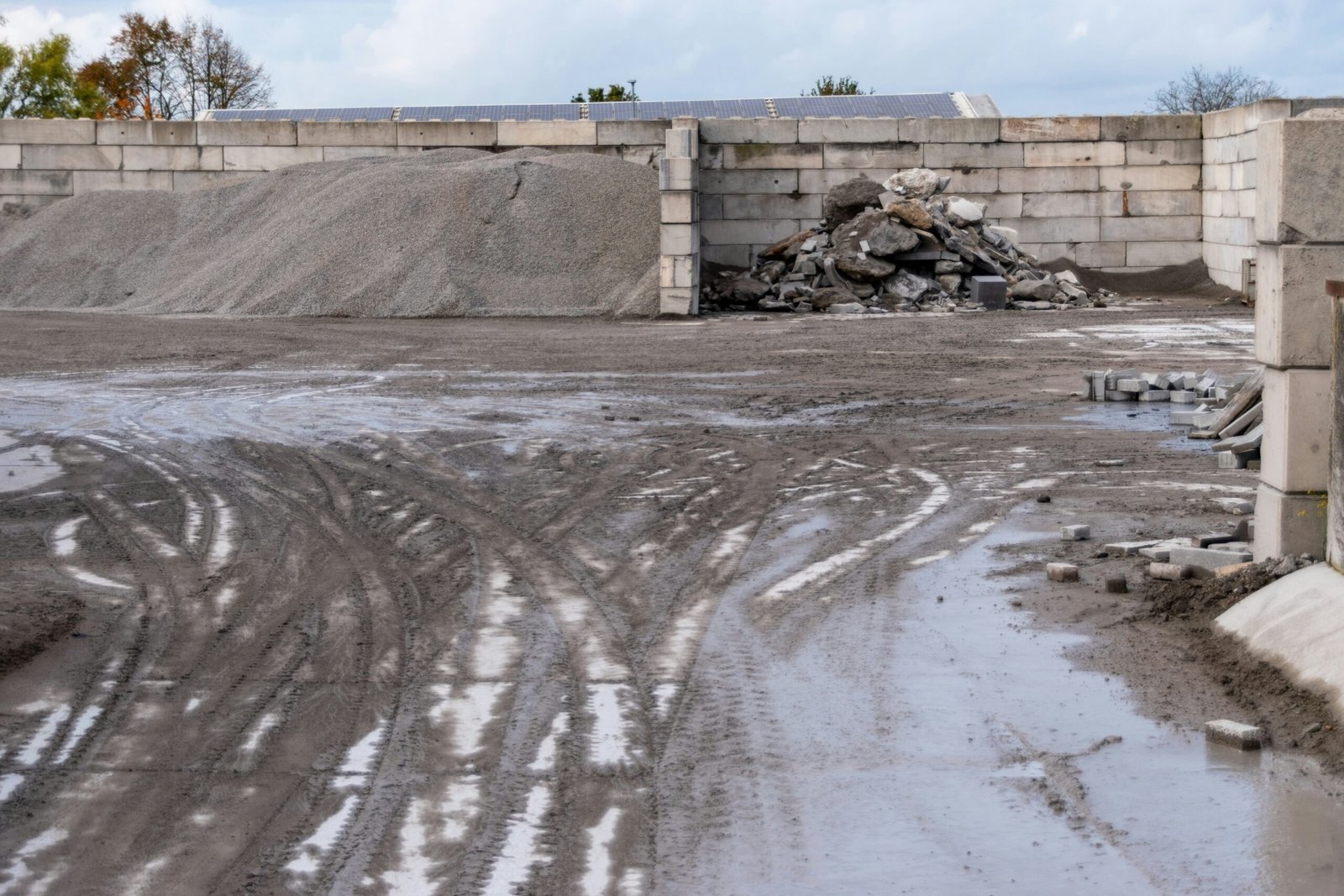 Construction site with piles of gravel and debris