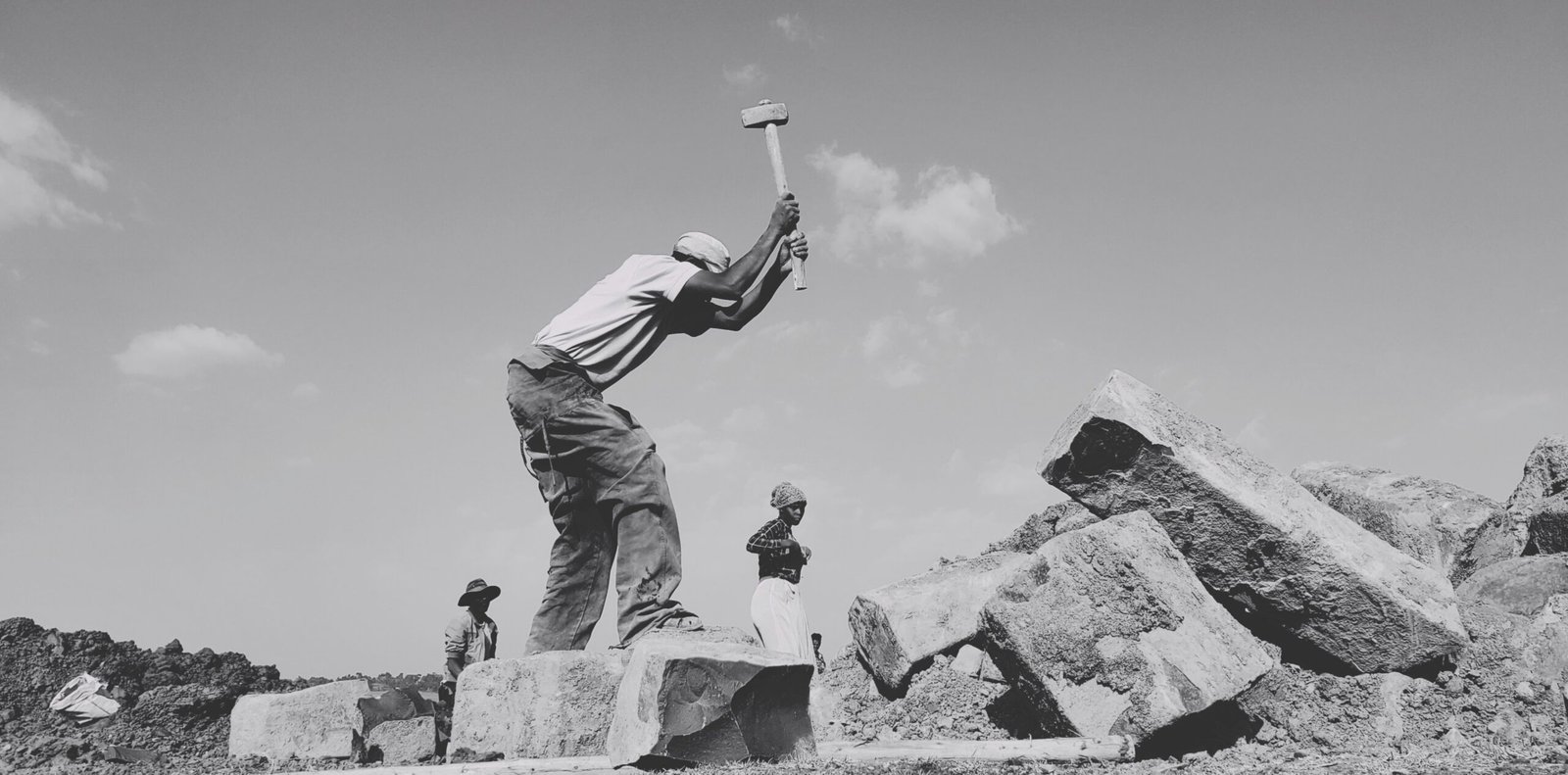 a man jumping off a rock