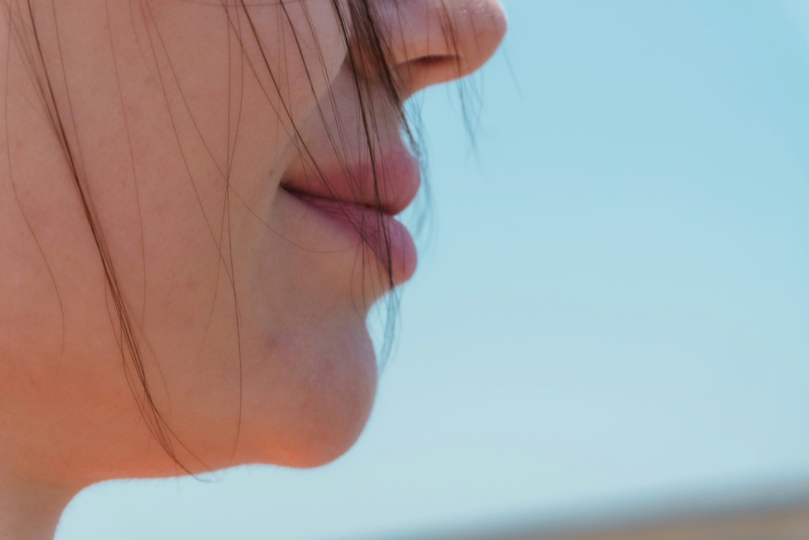Close-up profile of a person's mouth and chin