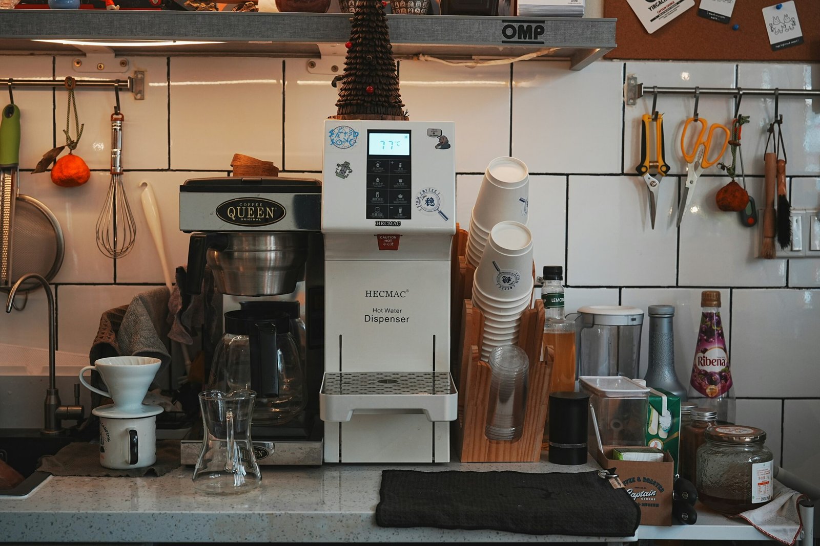 A kitchen counter with a coffee maker and other kitchen items