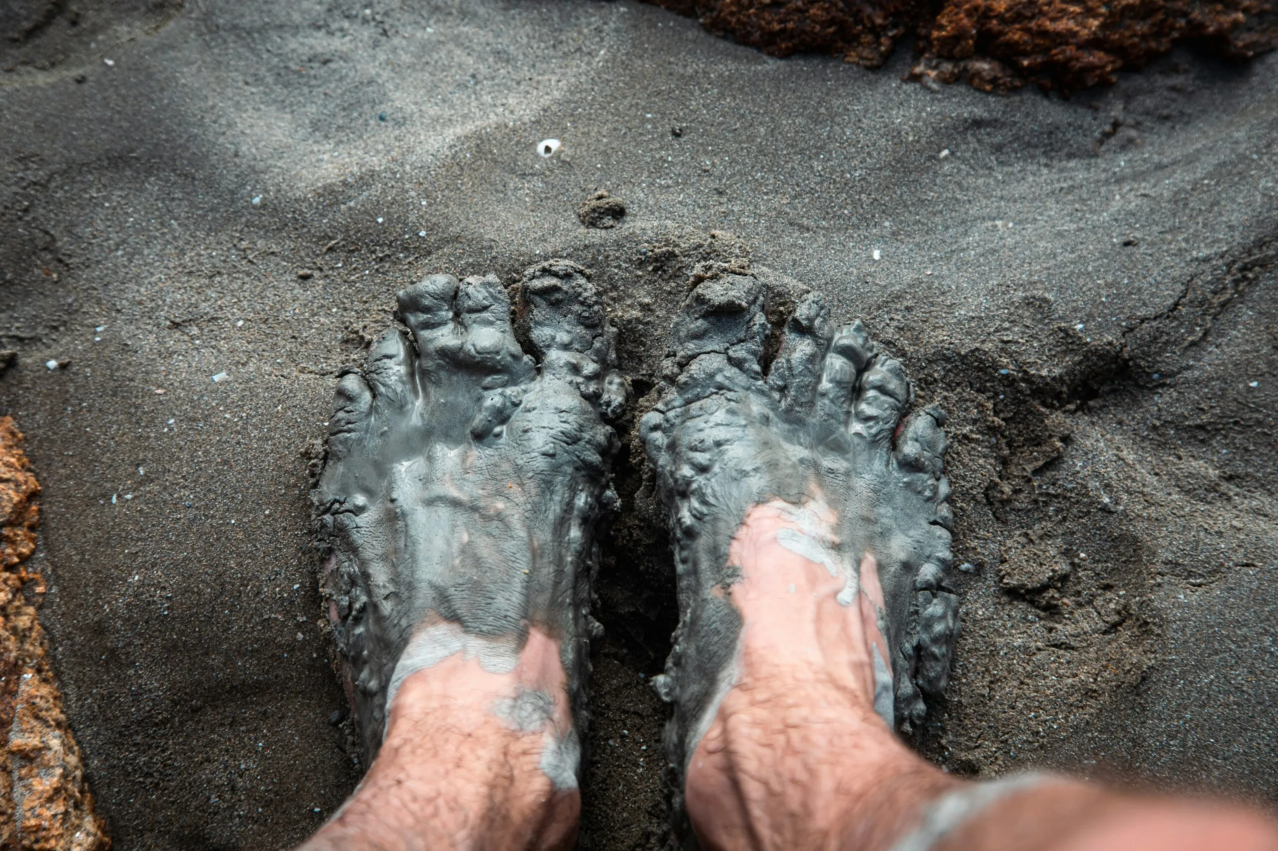 a pair of feet in the sand