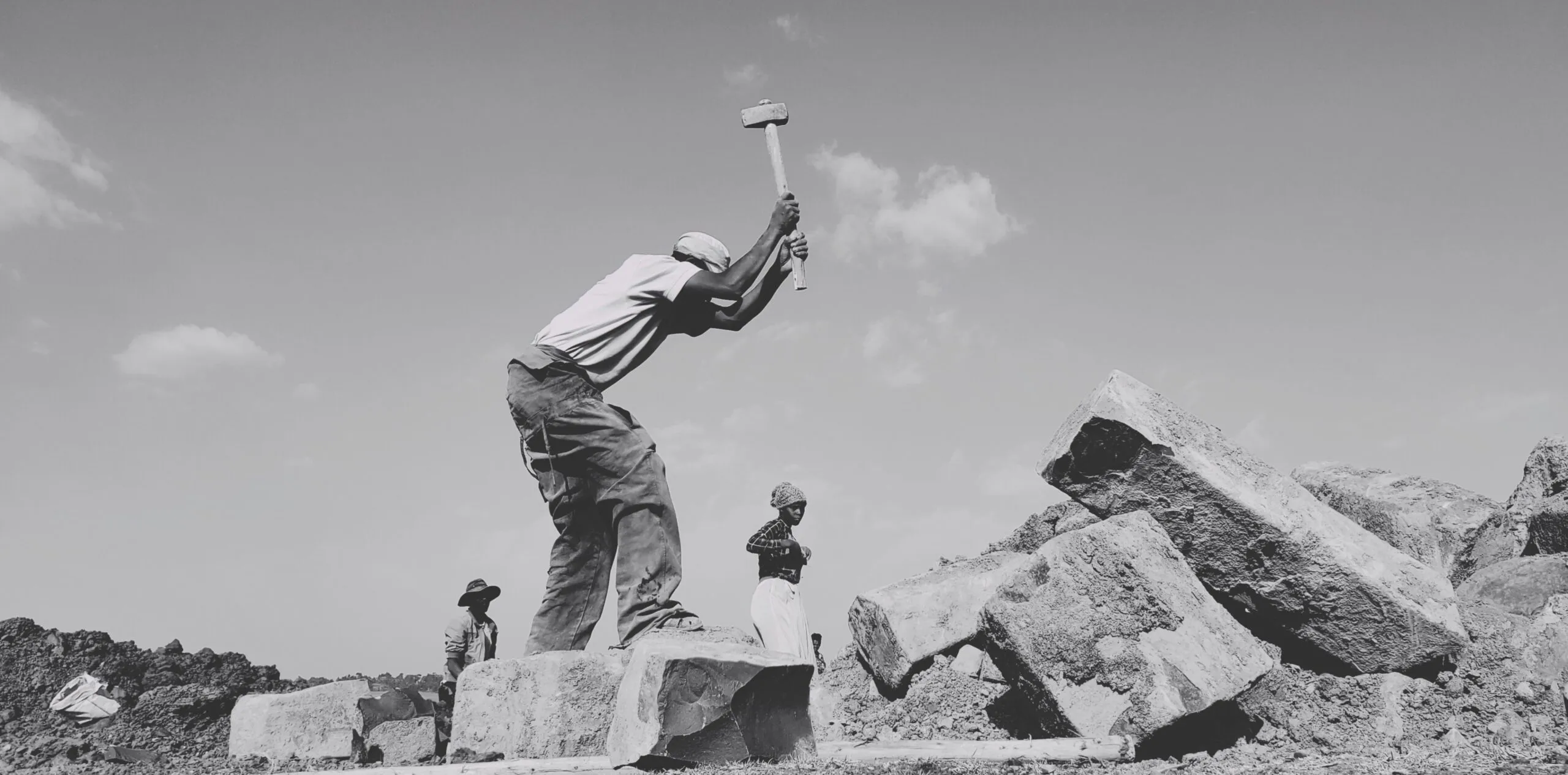a man jumping off a rock