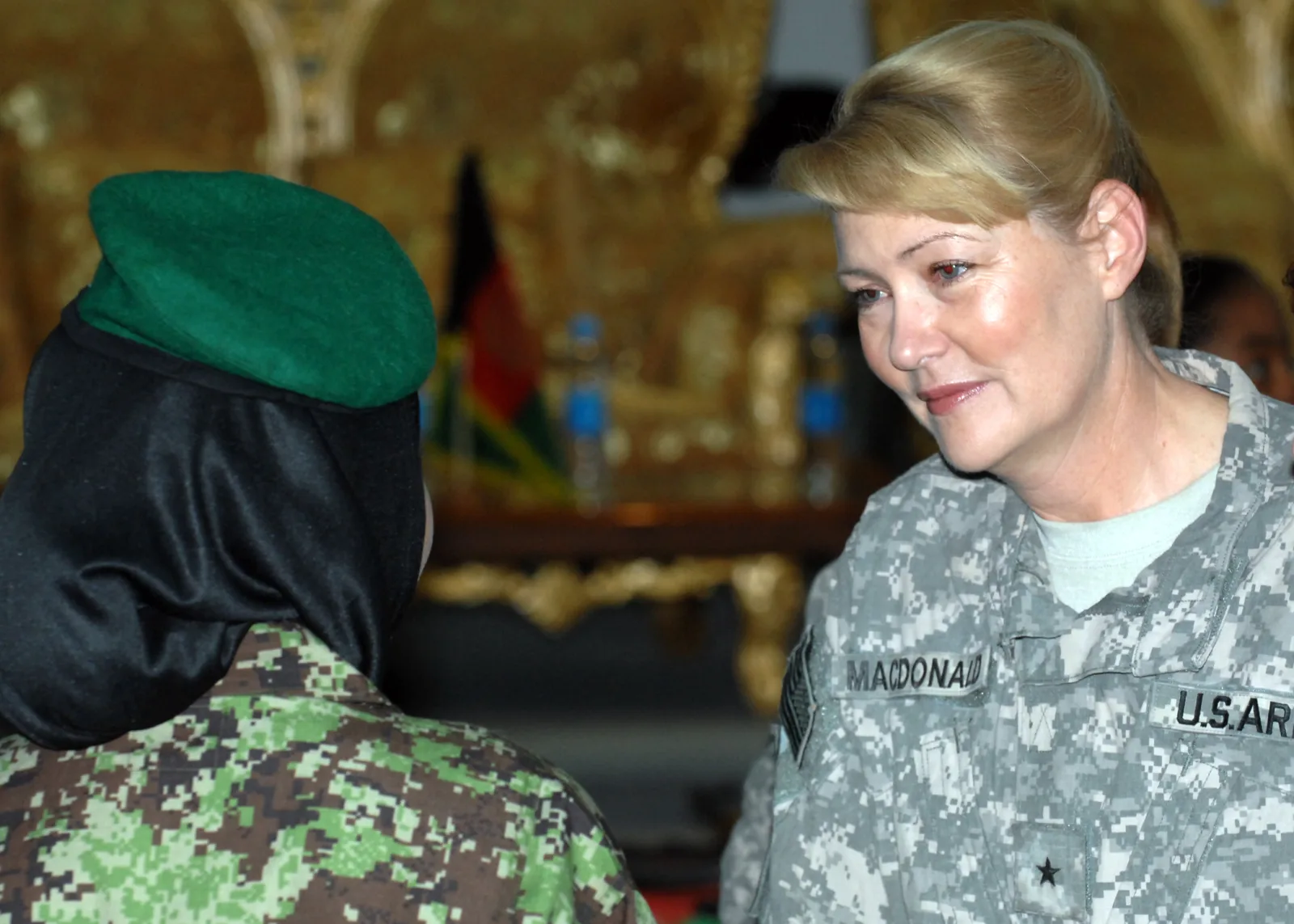 KABUL, Afghanistan (May 27, 2010) -- Brig. Gen. Anne Macdonald, NATO Training Mission-Afghanistan Assistant Commanding General of Police Development, greets candidates from the Women's Afghan National Army Officer Candidate School during an oath ceremony. In late April of this year, thirty women between the ages of 18-25 volunteered for the inaugural ANA Female OCS. (U.S. Air Force photo by Staff Sgt. Jeff Nevison)