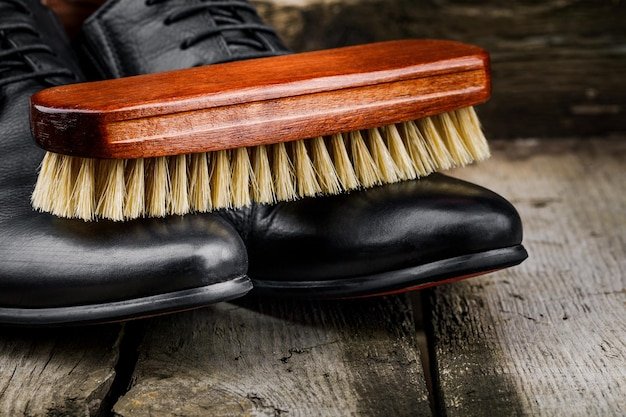 Accessories for the care and cleaning of shoes on a wooden table