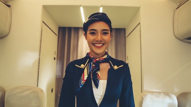 Cabin crew or air hostess working in airplane