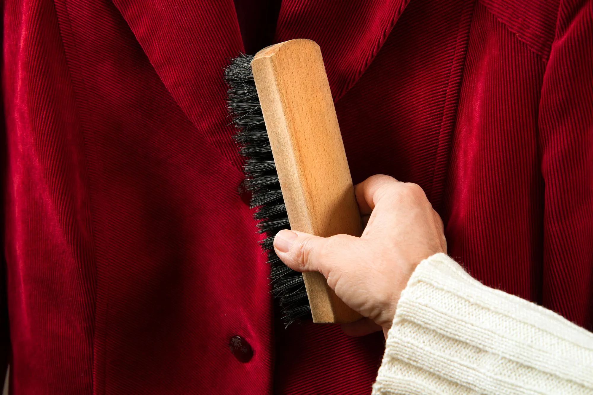 Cleaning clothes with a brush