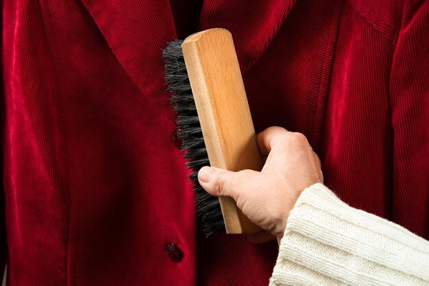 Cleaning clothes with a brush
