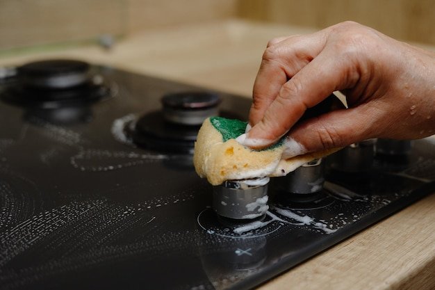 Close up of a stove the person washes the stove