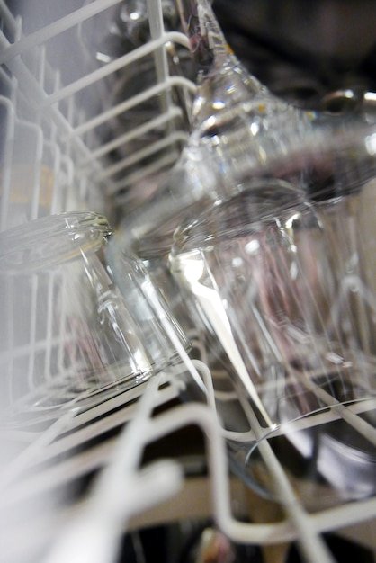 Close-up of wine glasses in rack