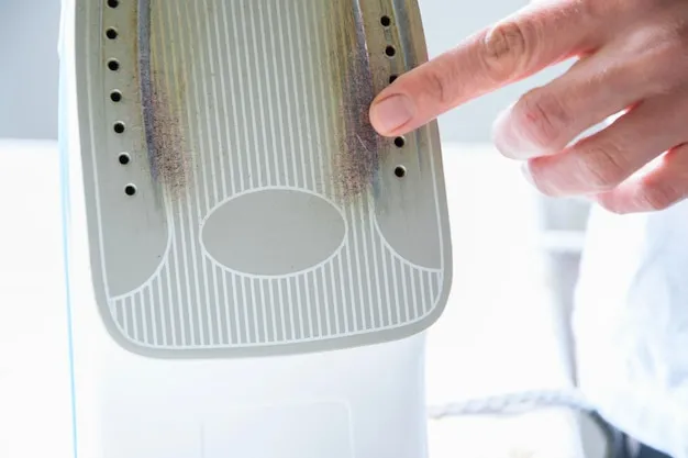 Close-up of woman touching iron