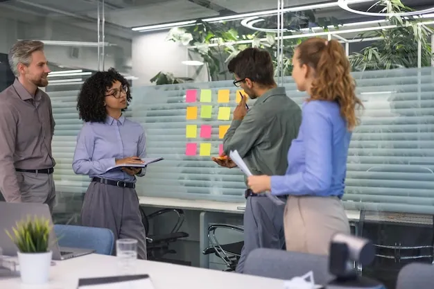 Creative group or business people planning innovation with sticky notes on glass wall
