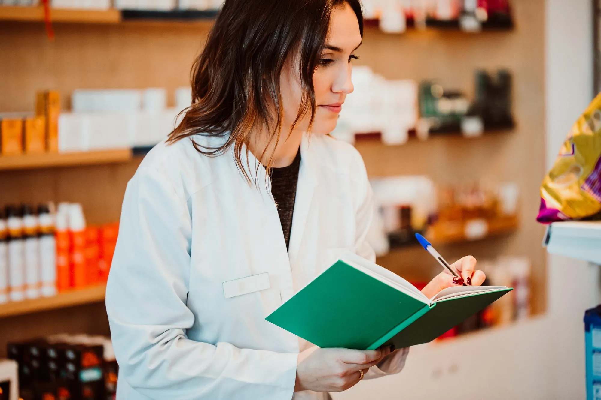 Female pharmacist working at store