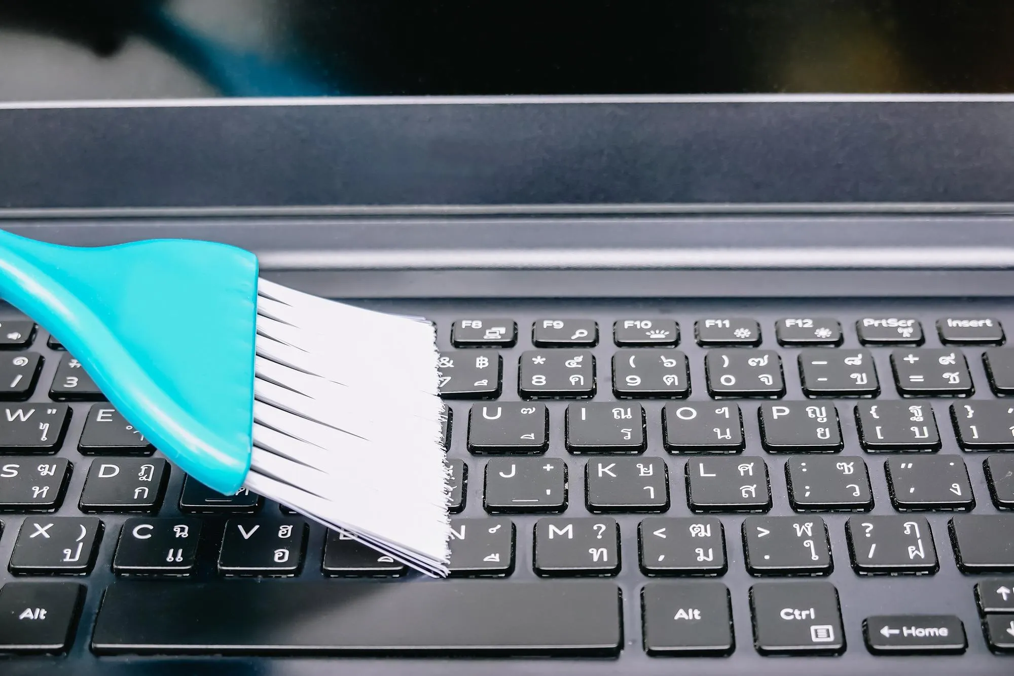 High angle view of brush on keyboard