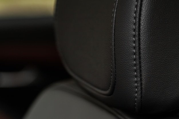 High angle view of modern car fabric seats. Close-up car seat texture and interior details. Detailed image of a car pleats stitch work.