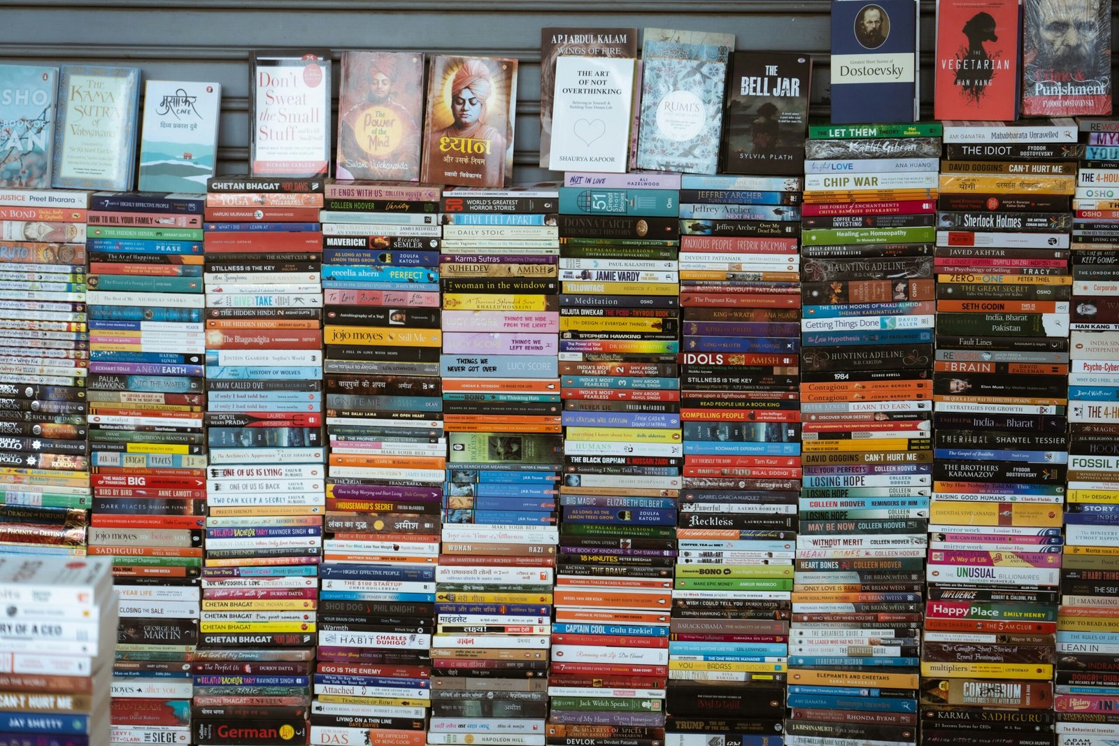 Wall of books with many colorful spines