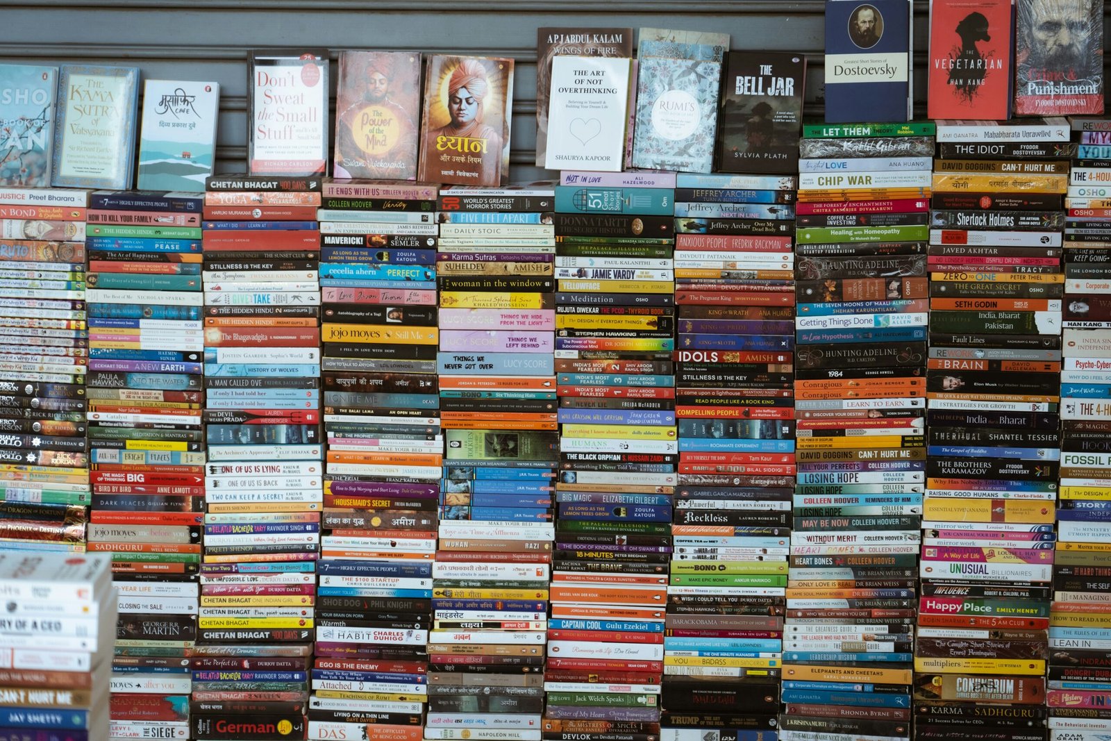 Wall of books with many colorful spines