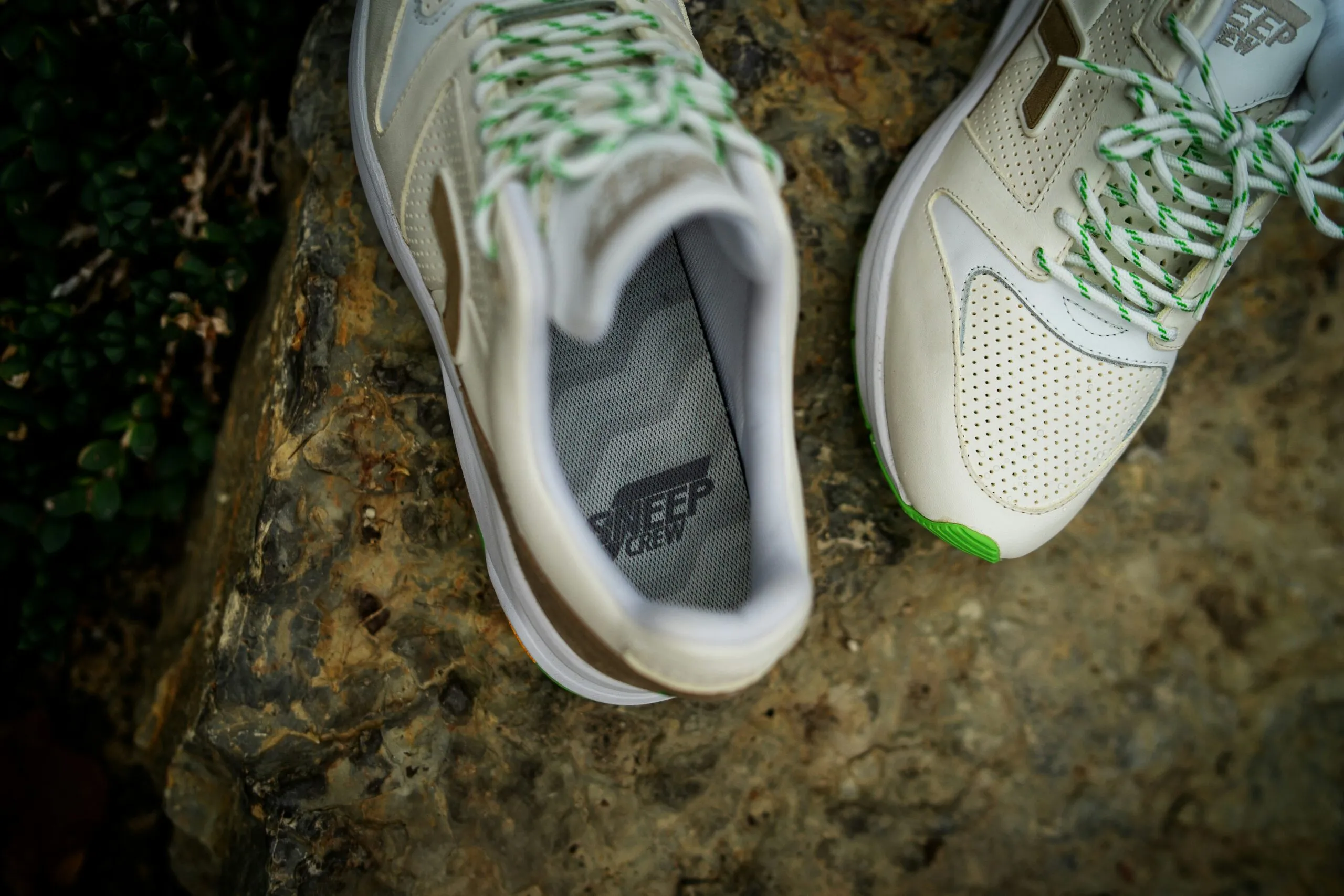gray and green nike athletic shoes