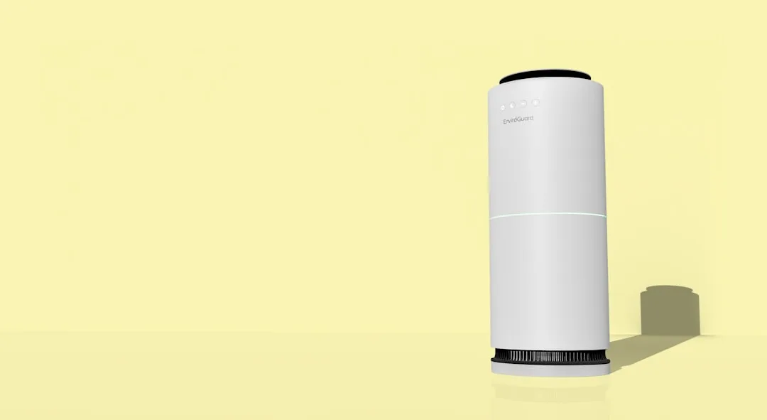 A white cylindrical object with a black top and bottom.
