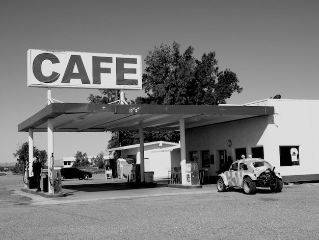 Information sign on built structure in city during sunny day