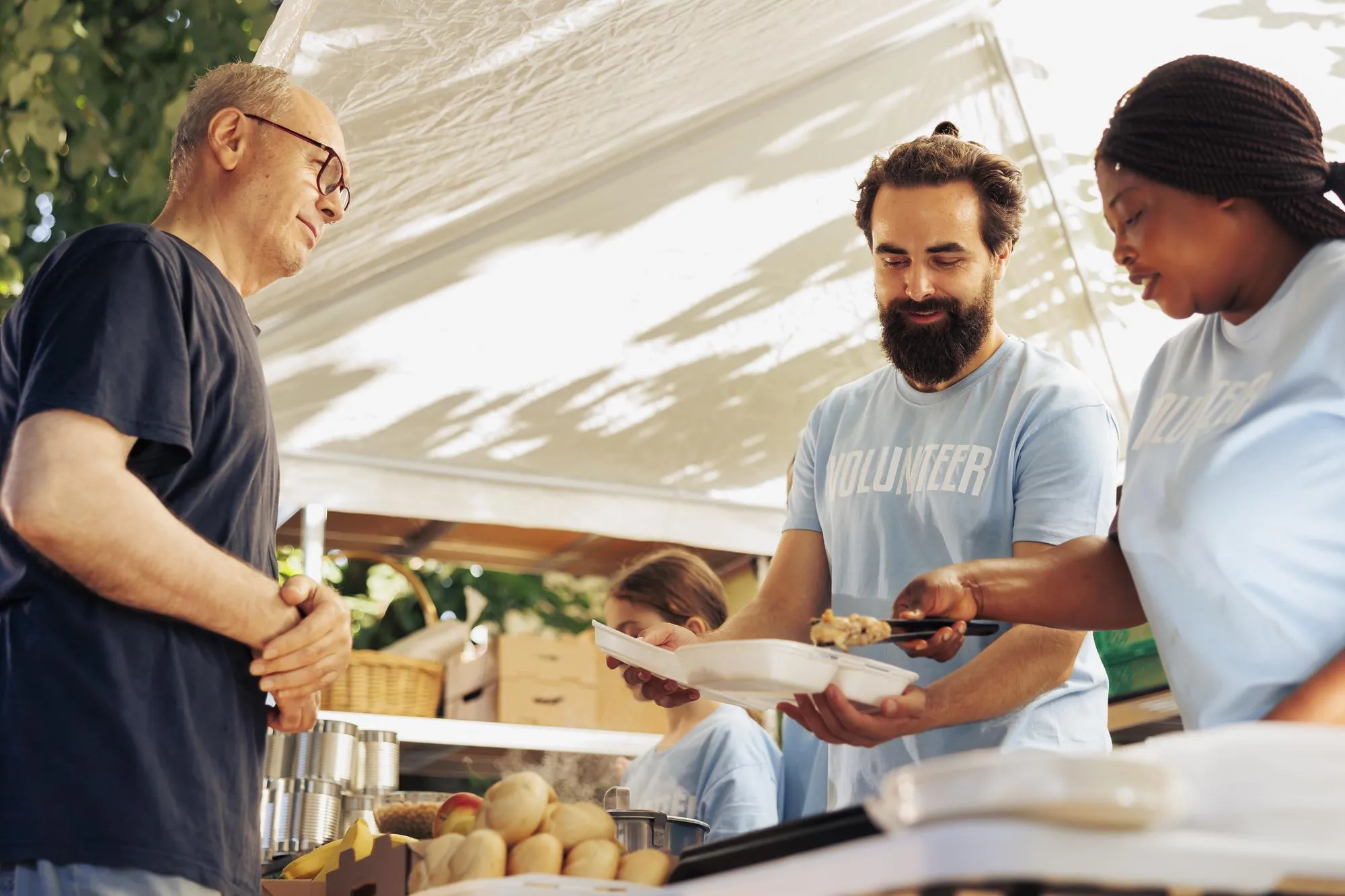 Multiracial volunteers serve the homeless