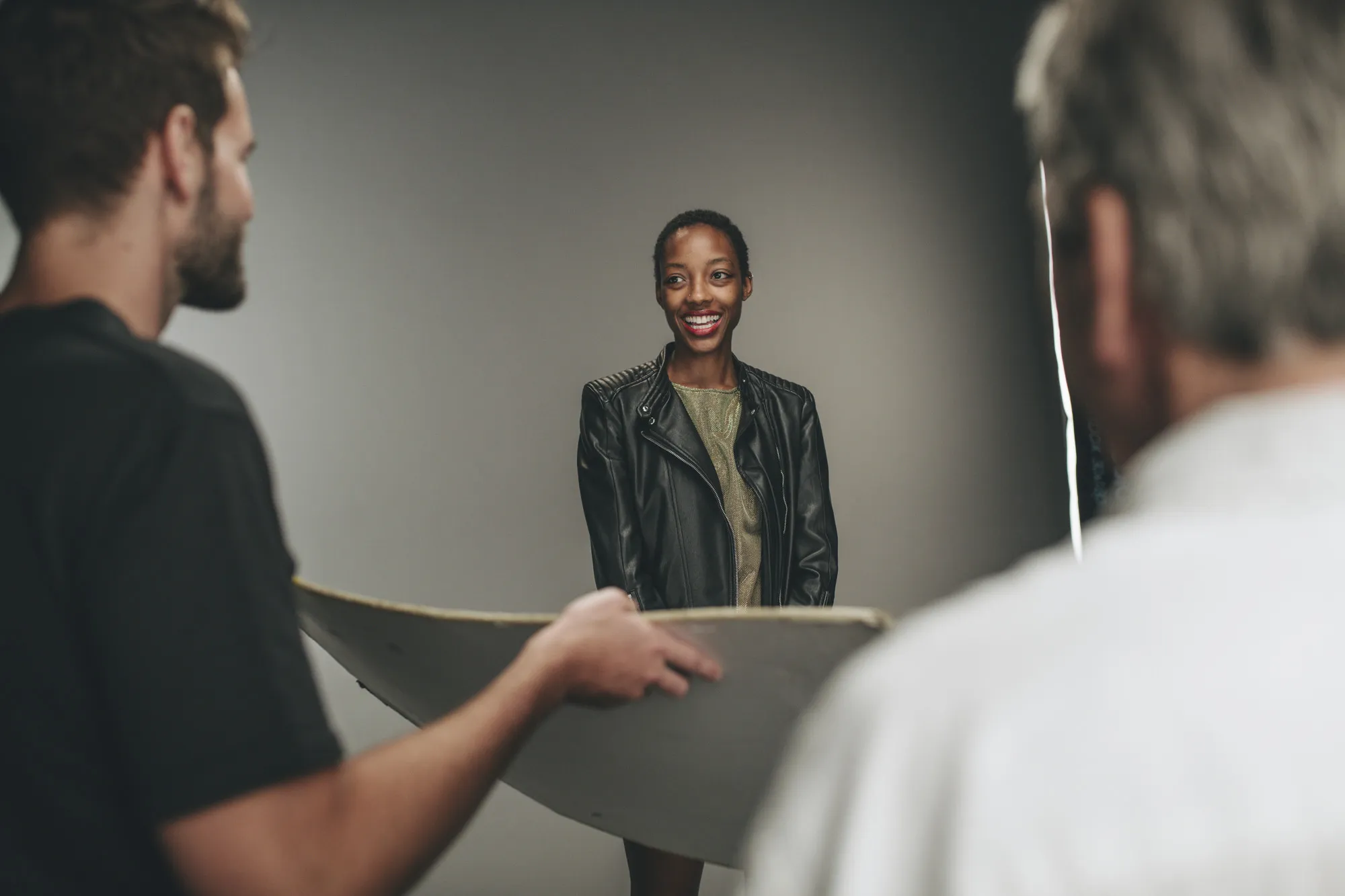 Photographer assistant holding a reflector