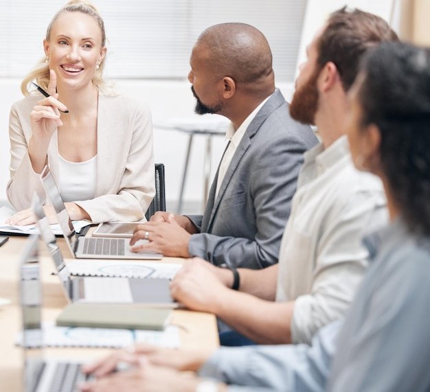 Running them through her strategy. Cropped shot of an attractive young businesswoman addressing her colleagues during a meeting in the boardroom.