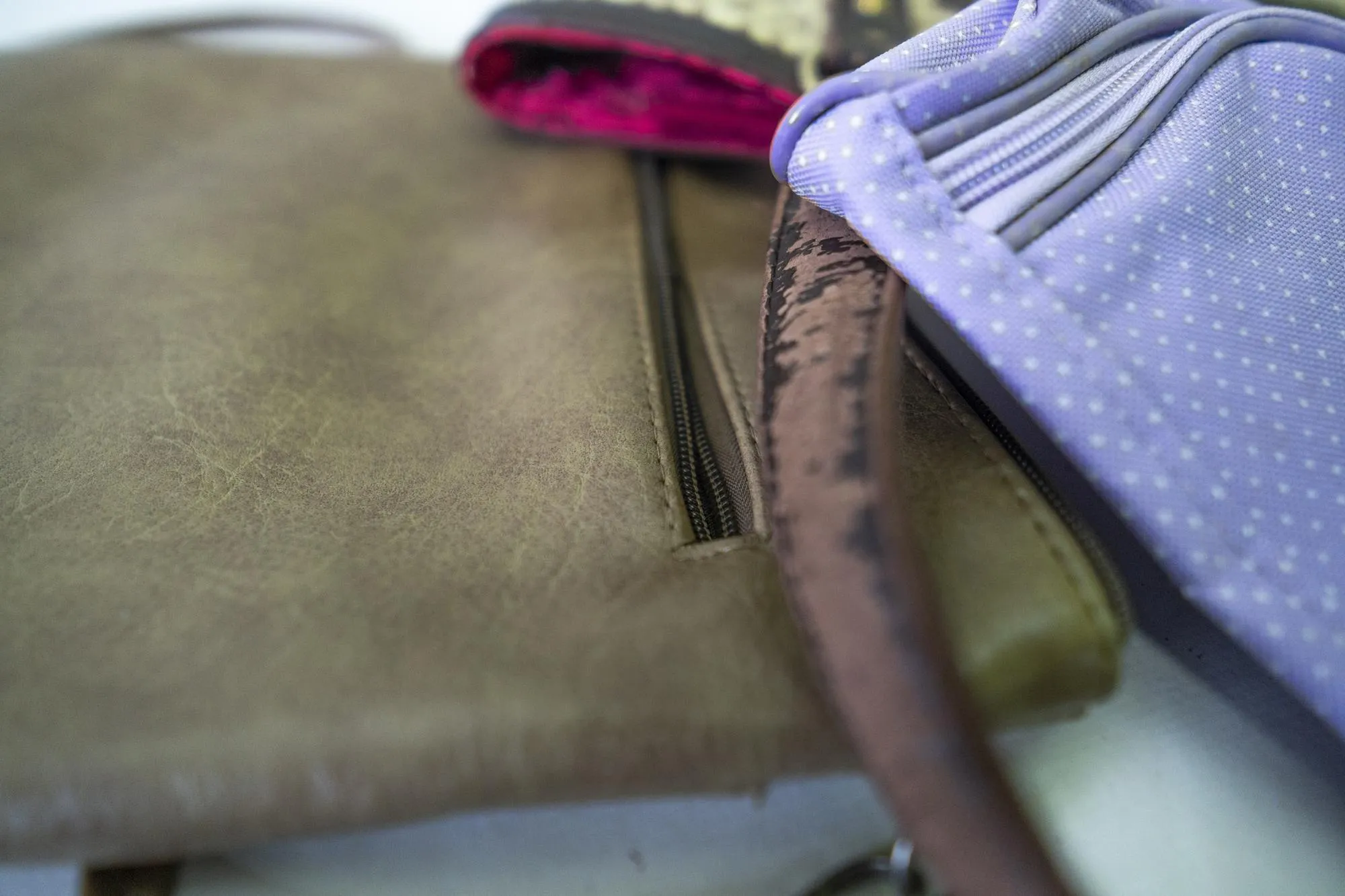 Various bags with handle and zipper details
