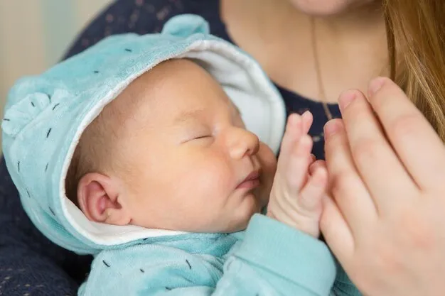 Woman and man holding a newborn Mom dad and baby Portrait of young smiling family with newborn on the hands