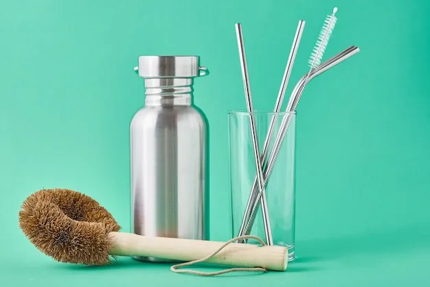 Zero waste concept. Eco friendly reusable items aluminum bottle and metal tubes in glass on green wall