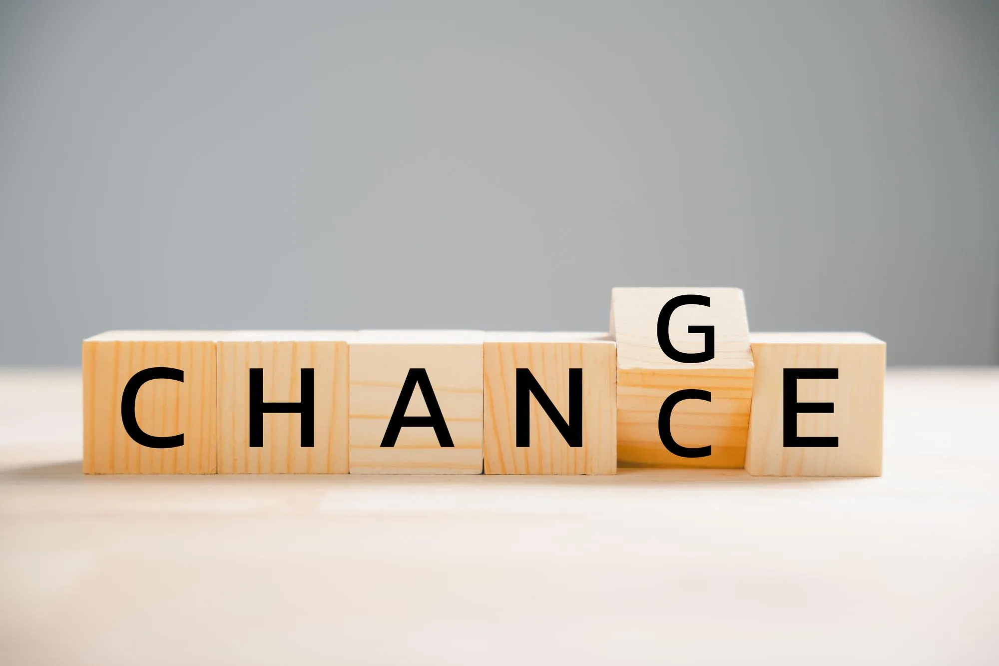 Flipping CHANGE to CHANCE on wooden block turns cube embodying personal development and career growth Creative business concept on wood background Seize the opportunity to transform your life