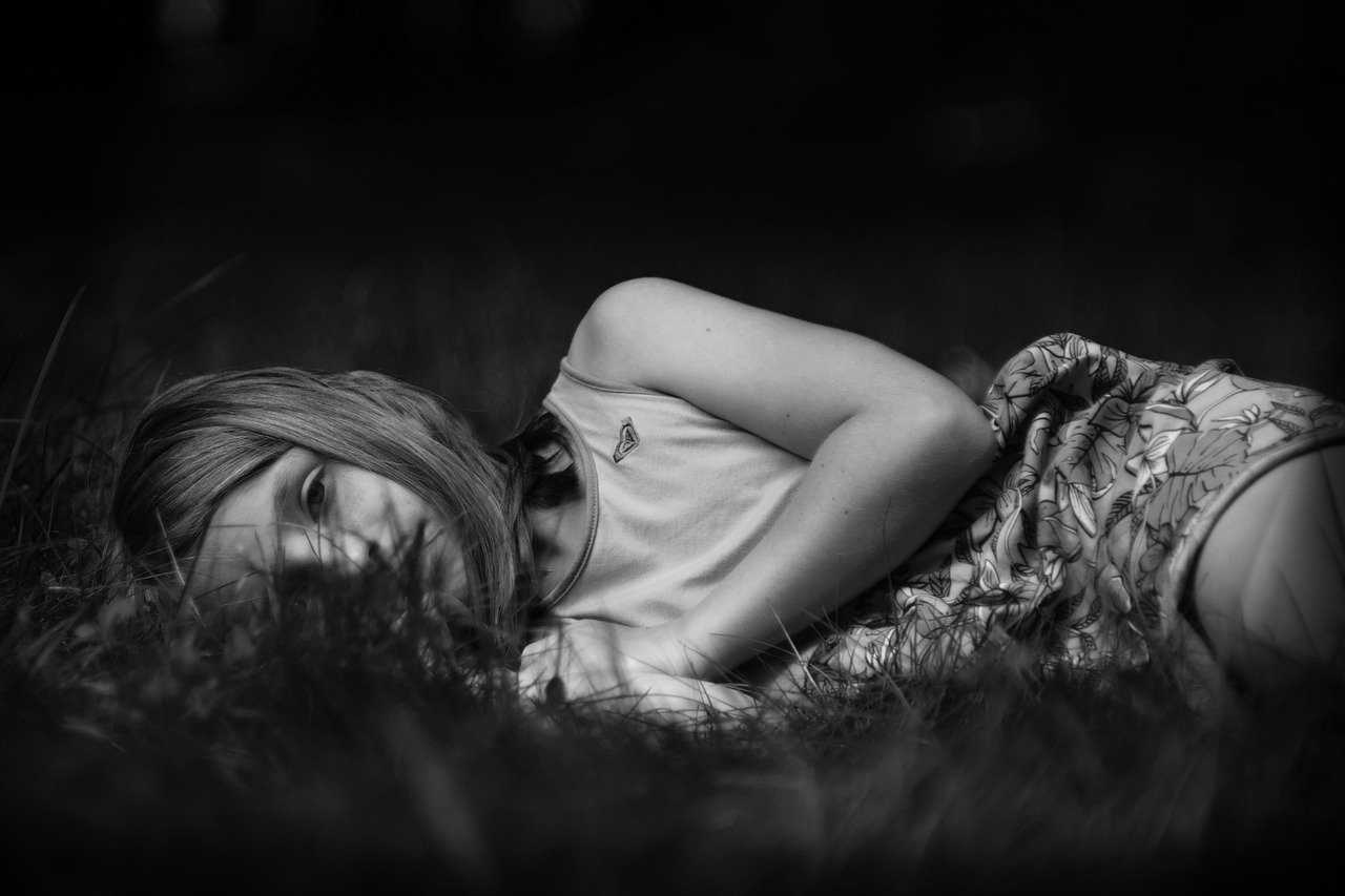 girl, sad, monochrome, lying, meadow, grass, child, young, nature, sad girl, woman, female, person, crying, depression, depressed, lonely, unhappy, sadness, alone, outdoors, portrait