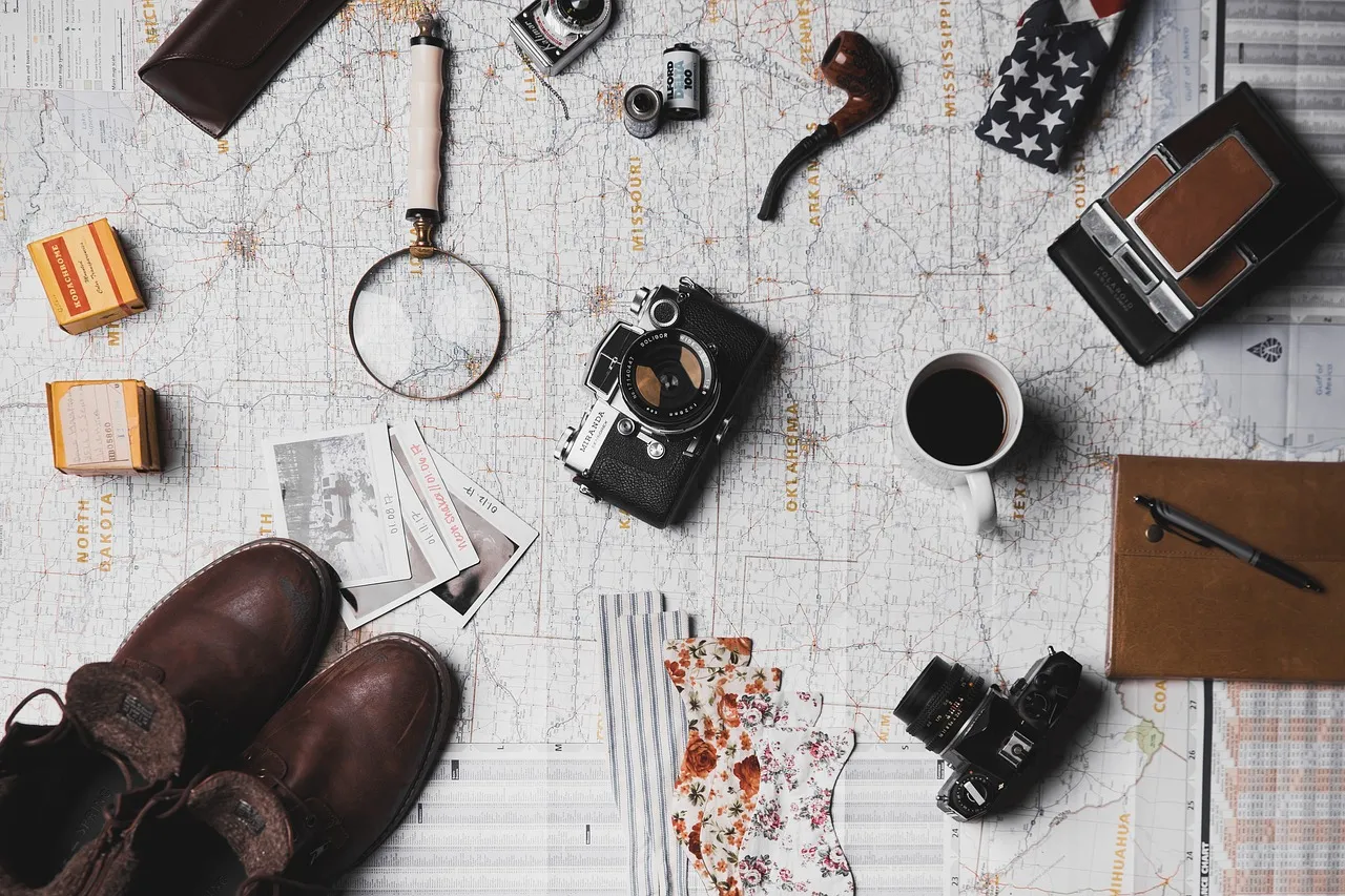 map, microscope, coffee, camera, pen, notebook, shoes, footwear, travel, outdoor, map, map, camera, camera, camera, camera, camera, shoes, travel, travel