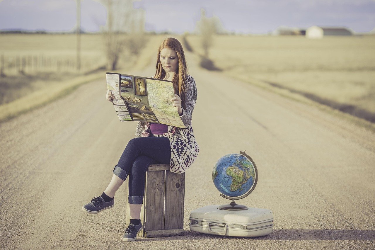 globe trotter, traveller, globe, map, journey, planning, waiting, female, woman, world, road, dirt road, travel, traveling, world map, outdoors, young woman