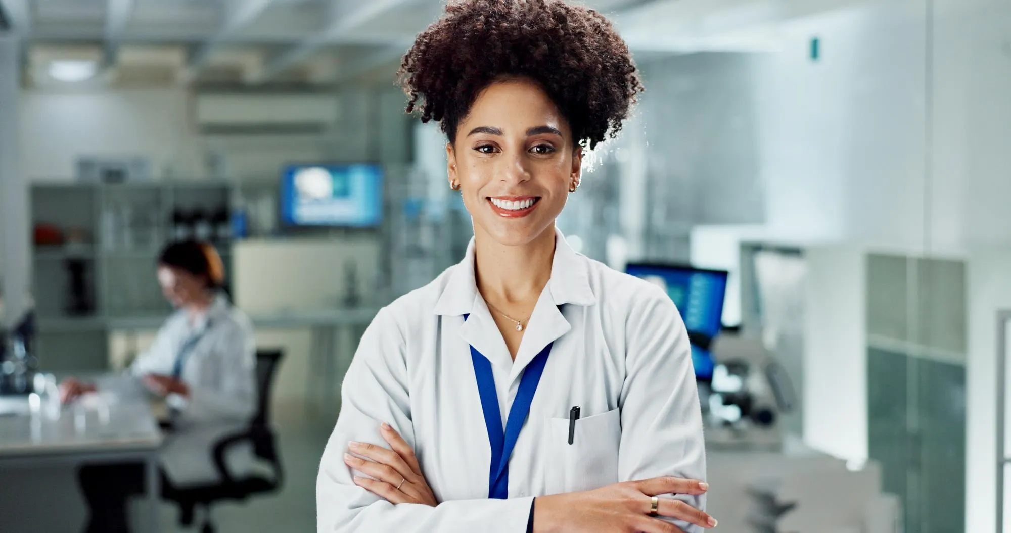Happy woman portrait and professional scientist with confidence at lab for science research or discovery Female person or biologist with smile or arms crossed for scientific or medical career