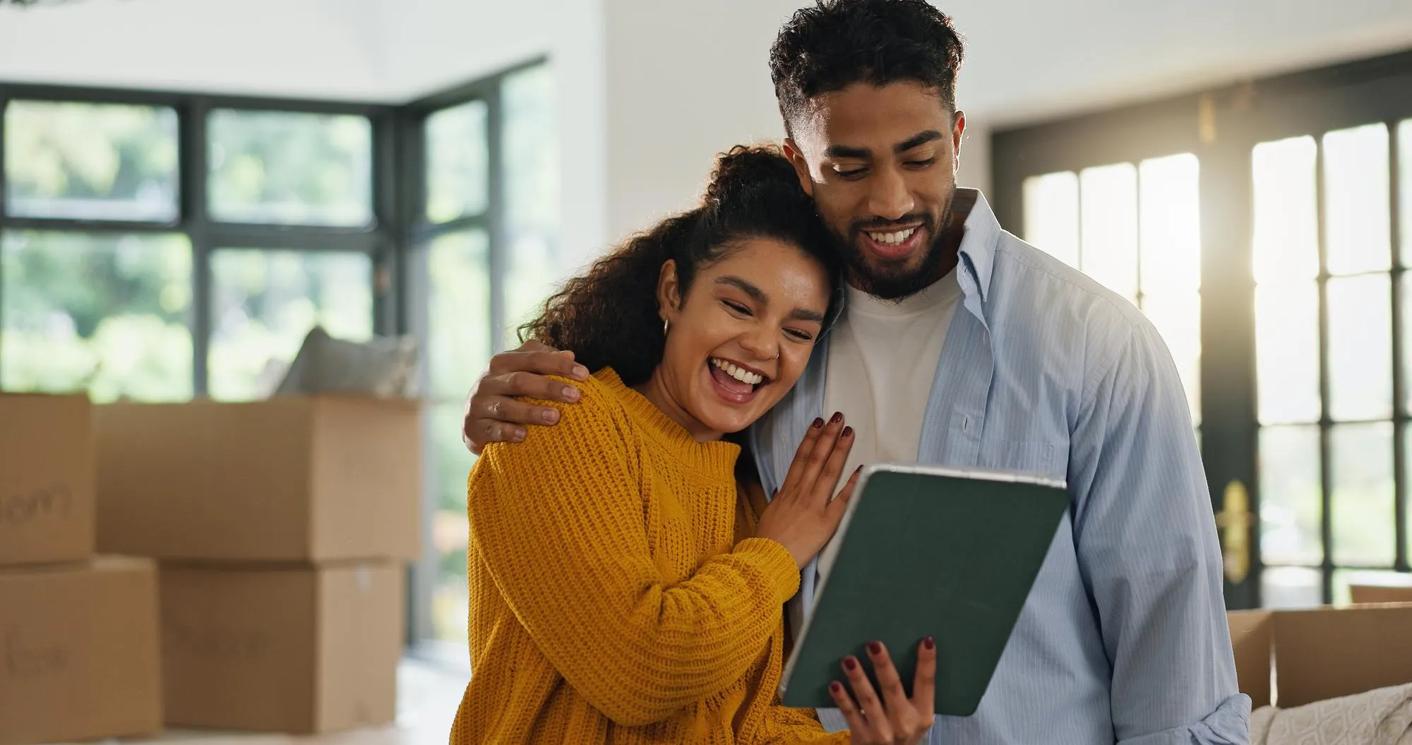Tablet reading and moving with couple in new home for property support or mortgage success Real estate investment celebration or loan approval with man and woman in living room for house purchase
