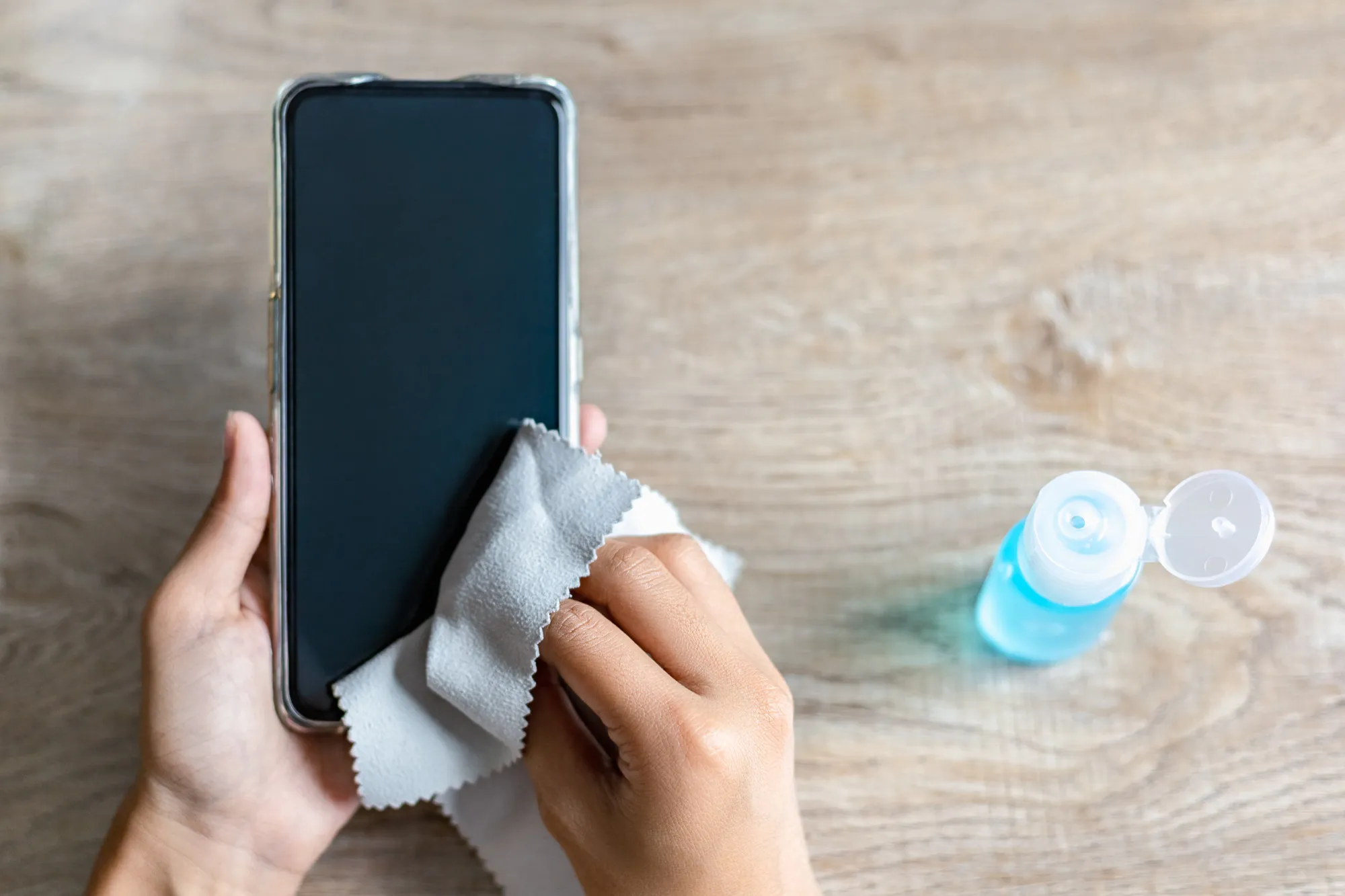 Woman hand is wiped clean with a cloth and alcohol.