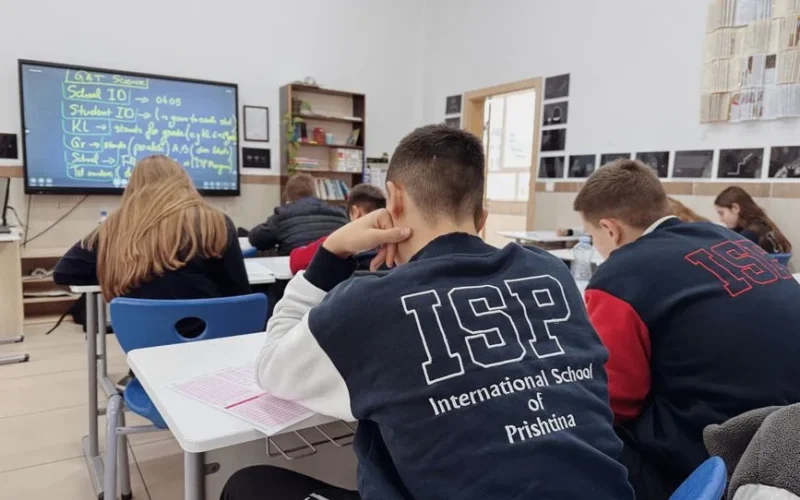 Students attentively learning in a classroom at the International School of Prishtina.