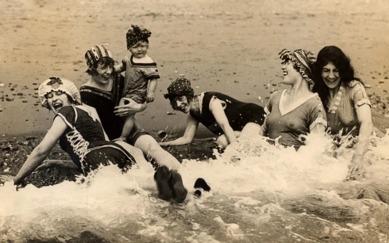 a woman celebrating her birthday with friends and a cake