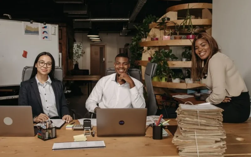 A diverse team of business professionals working together in a modern office setting.