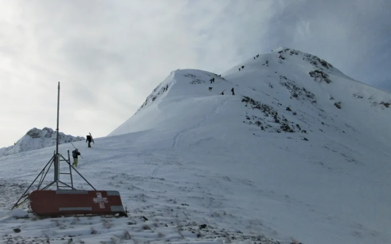 Skiers climbing the north ridge of Storm Peak near Silverton, Colorado.