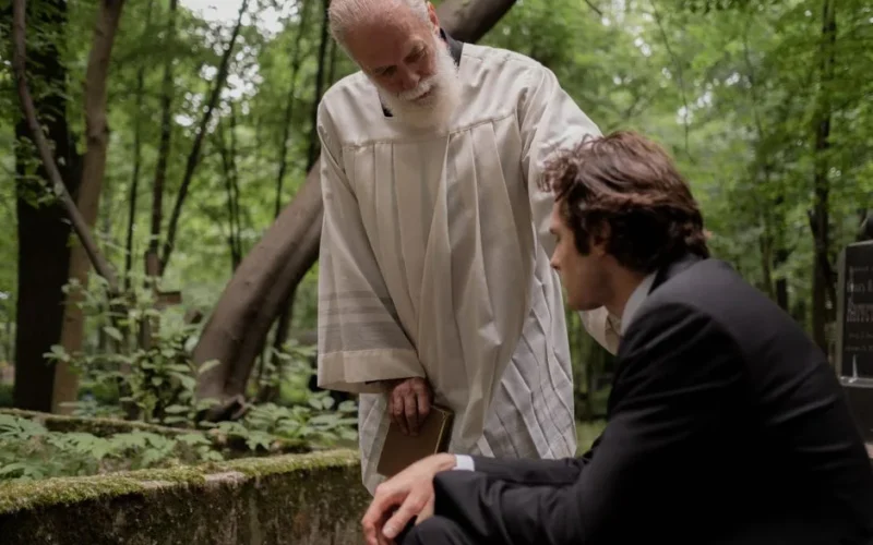 A gentle pastoral scene of sympathy and support in a serene forest setting.