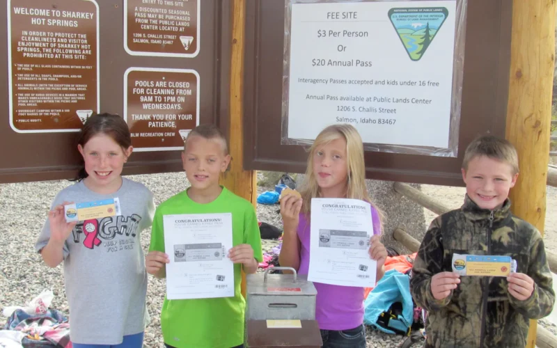 An Outdoor Classroom Experience Salmon’s Fourth Graders Won’t Soon Forget Students can learn about the cultural and geological history of Lemhi County from a textbook. But fourth grade students from Salmon’s Pioneer Elementary School should came away from their visit to Sharkey Hot Springs with a lasting impression. Elementary teachers Nancy Bolyard and Connie Livingston, along with more than 60 fourth graders, as well as staff from the Salmon Field Office Bureau of Land Management, and local nonprofit Salmon Valley Stewardship spent a day at Sharkey Hot Springs. Retired BLM Geologist, Dennis Krasowski offered students a lesson on Lemhi County’s unique geological history, including how hot springs are formed. Because Sharkey Hot Springs is also located right along the Lewis & Clark National Historic Trail, students learned about Lewis & Clark’s adventures in Lemhi County, offered by local historian, Mike Crosby. Later, all of the kids, many of whom had never visited the site, had an opportunity to spend time in the pools, soaking in the natural spring waters. Photo by BLM Idaho.