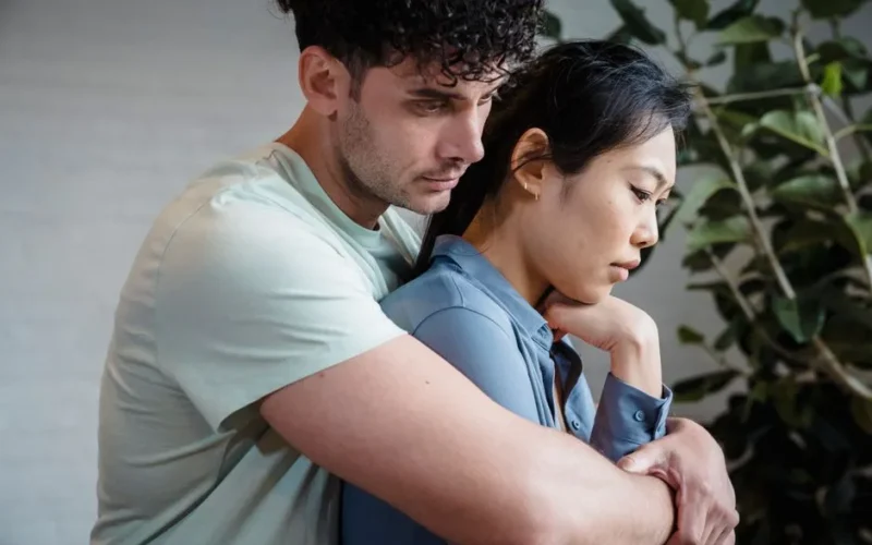 A close-up of a loving couple embracing, symbolizing intimacy and connection.