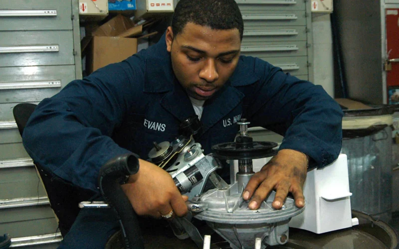 Arabian Gulf (June 22, 2004) - Fireman John Evans, from Columbus, Ohio, performs maintenance on a washing machine motor aboard USS George Washington (CVN 73). The Norfolk, Va. based Nimitz-class aircraft carrier is on a regularly scheduled deployment in support of Operation Iraqi Freedom (OIF). U.S. Navy photo by Photographer's Mate Airman Rex Nelson (RELEASED)