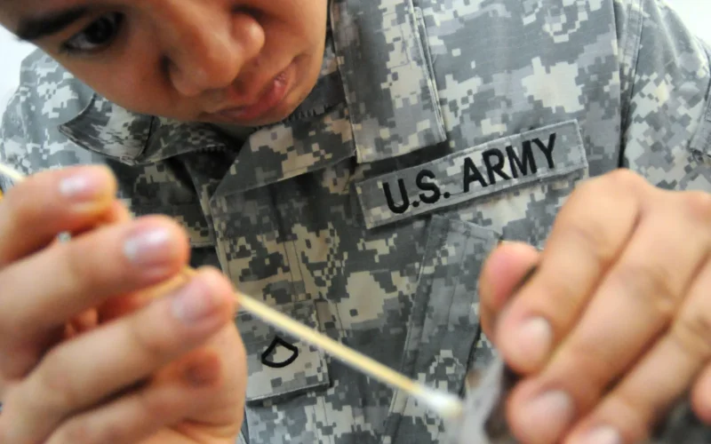 Army Pfc. Charleston Go, a veterinary food inspector at the Guantanamo Bay Veterinary Treatment Facility, cleans the ears of a kitten up for adoption, July 14. The clinic treats the pets of service members and Department of Defense employees who work with Joint Task Force Guantanamo and U.S. Naval Station Guantanamo Bay. JTF Guantanamo provides safe, humane, legal and transparent care and custody of detainees, including those convicted by military commission and those ordered released by a court. The JTF conducts intelligence collection, analysis and dissemination for the protection of detainees and personnel working in JTF Guantanamo facilities and in support of the War on Terror. JTF Guantanamo provides support to the Office of Military Commissions, to law enforcement and to war crimes investigations. The JTF conducts planning for and, on order, responds to Caribbean mass migration operations.