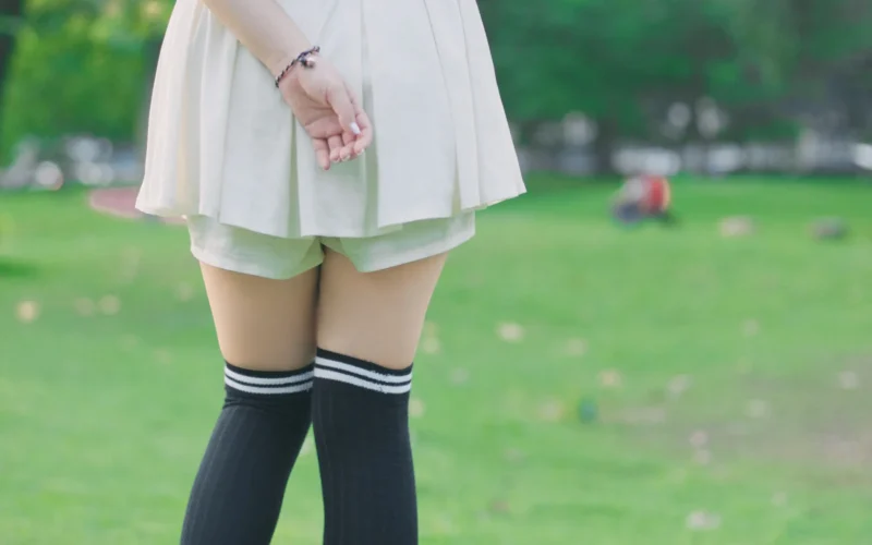 A girl wearing white shoes and skirt, April 2016.