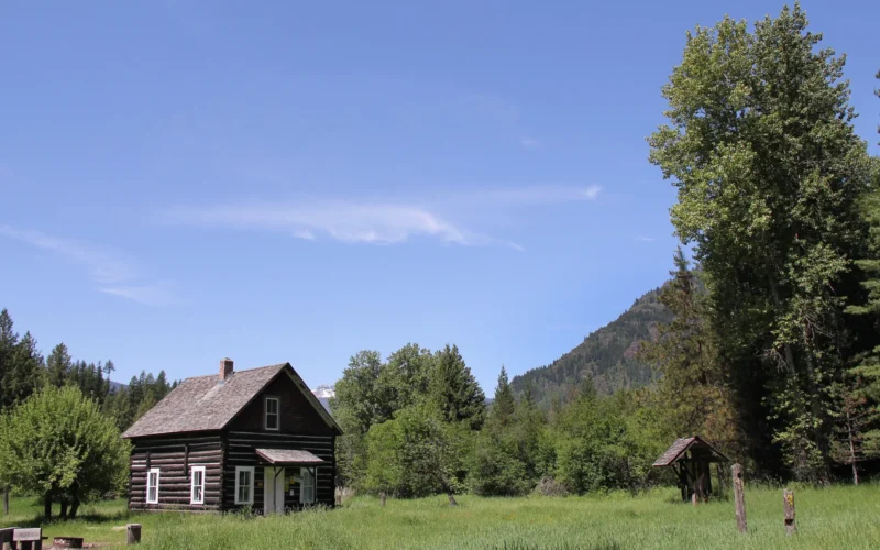 The Bull River Guard Station was built in 1908 as the Ranger's house and office. This structure was a primary ranger station from 1908 to 1920, surviving the 1910 fire. The cabin was home to Granville "Granny" Gordon (District Ranger), his wife and three daughters. When the 1910 fires roared thru the country, Mrs. Gordon prepared for the worst by soaking gunny sacks in a tub of water. If they had to escape the fire, they would wrap themselves in the gunny sacks and race to the Bull River to wait out the fire. As the fire closed in on the ranger station, it shifted direction and swept up Pilik ridge sparing their home. The cabin is a two story building, containing 700 square feet. It is equipped with period furniture including three full beds and two single beds including mattresses. It has a sitting room with chairs, a kitchen / dining room with a hutch, table and chairs, and electric range. It is heated with a forced air electric furnace, and contains cleaning supplies. The cabin is not plumbed for water and has an outdoor toilet. In the winter the cabin is normally plowed within 1 mile. The cabin can be reserved 3 days in advance of your stay by contacting the Ranger Station or Contact the National Recreation Reservation Service at 1-877-444-6777 or www.recreation.gov, the cabin can be reserved 180 days in advance of your stay.
