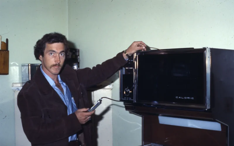 William Roger Ross, a Development Assistant with the City of Columbus Department of Development, Division of Housing Inspection, inspects a Caloric gas range.