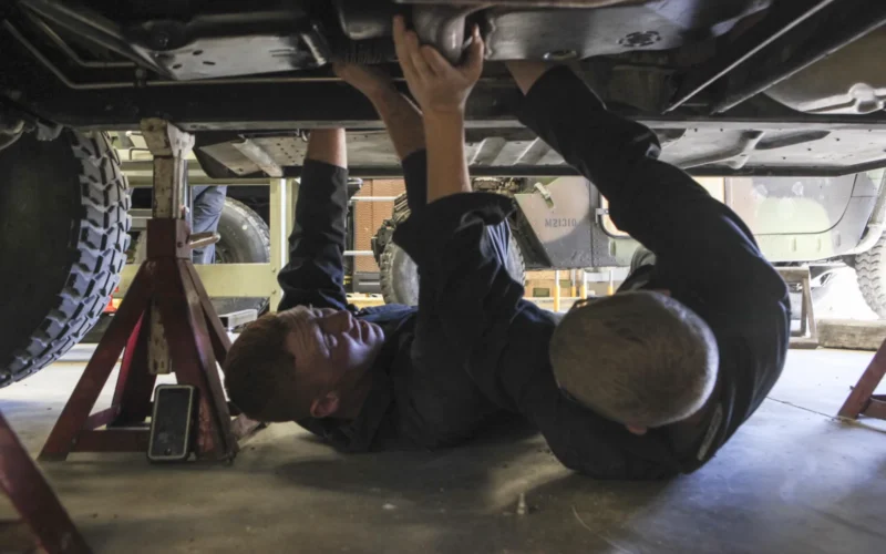 Lance Cpl. Joseph Lee, left, and Pfc. Quentin C. Johnson, automotive organizational mechanics with 2nd Transportation Support Battalion, Combat Logistics Regiment 2, remove an exhaust pipe from the underside of an M1123 Humvee aboard Marine Corps Base Camp Lejeune, North Carolina, March 19, 2015. The pipe was removed in order to prepare for the next level of maintenance, according to Johnson. “Everything needs transport,” Lee said. “Without transport, the gear doesn’t get moved in time and the personnel aren’t where they need to be fast enough. That’s why we need to keep the vehicles in working condition.” (U.S. Marine Corps photo by Pfc. David N. Hersey/Released)